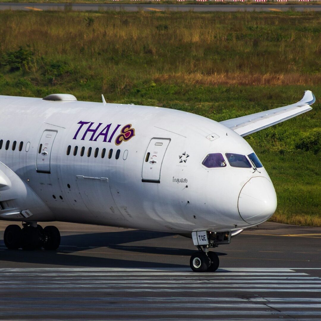A large white airplane on a run way